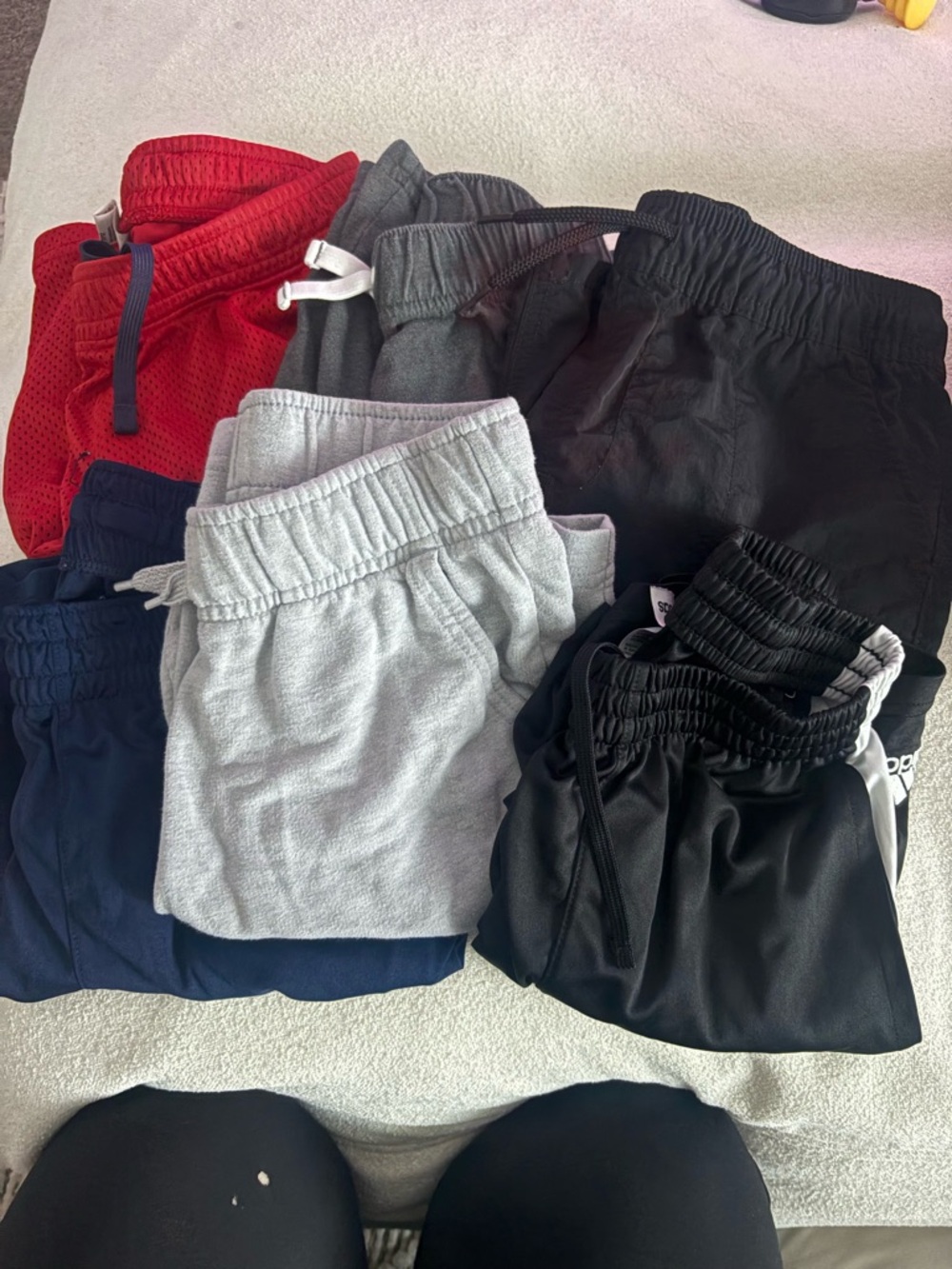 6 pairs of boys shorts - 4 size 8-10 and 2 pairs 10-12 . Red, Gray, Black, Navy